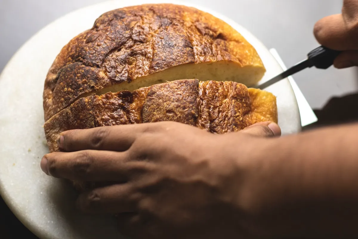 "Sourdough discard in a glass jar, illustrating the byproduct removed from sourdough starter and its use in baking."