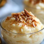 Creamy homemade rice pudding topped with cinnamon and fresh berries in a white bowl