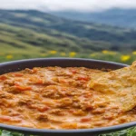 Rotel Dip Recipe – A creamy, cheesy dip with Rotel tomatoes and ground beef, served in a bowl with tortilla chips on the side.